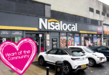 Image of a Nisa Local storefront in Cambuslang with cars parked out front and the Nisa Making a Difference Locally charity Heart of the Community logo to the side.