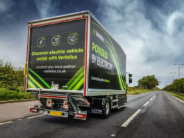SWA offers electric HGVs to rent Renault Vertellus electric vehicle truck drives down a road with a dark sky.