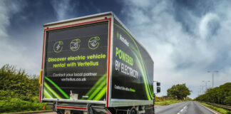 Renault Vertellus electric vehicle truck drives down a road with a dark sky.