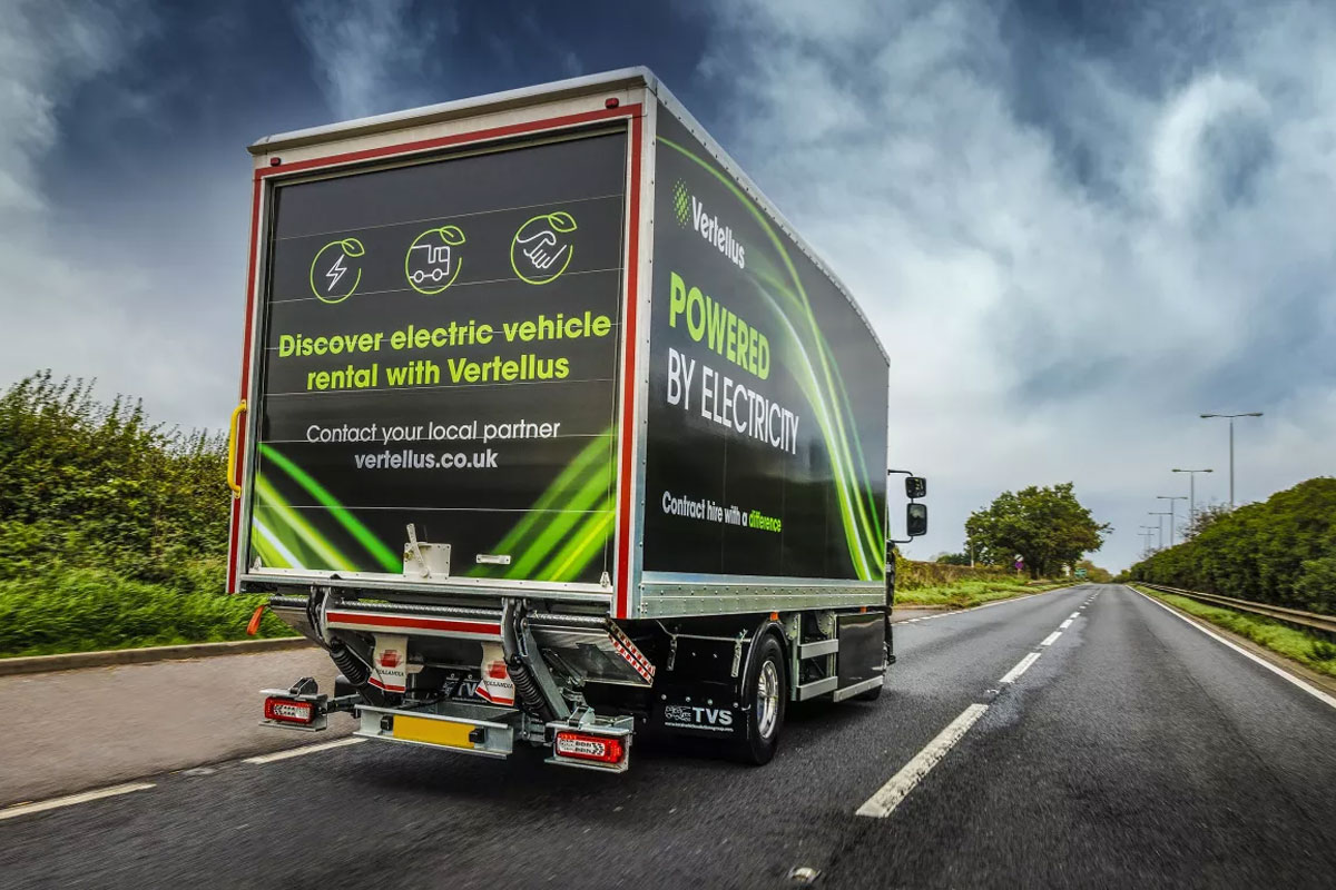 Renault Vertellus electric vehicle truck drives down a road with a dark sky.