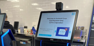 A Scotmid Co-op self-service checkout machine with a notice informing customers about CCTV in operation.