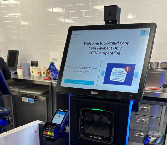 Scotmid unveils a digital transformation A Scotmid Co-op self-service checkout machine with a notice informing customers about CCTV in operation.