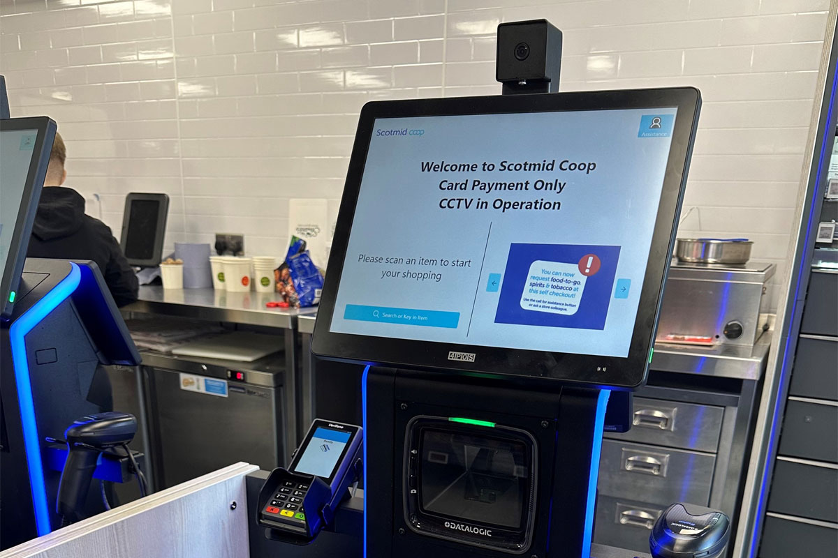 A Scotmid Co-op self-service checkout machine with a notice informing customers about CCTV in operation.