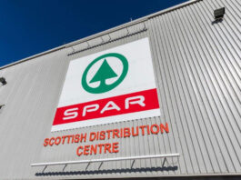 Positive financial year for Spar Scotland Exterior shot of Spar Scottish Distribution Centre with the Spar logo on the side of the building.