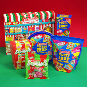 Swizzels Christmas range for 2024, including The Sweet Shop Favourites Advent Calendar, Sweet Treat Tub, Sweet Shop Favourites Carton, Swizzels Squashies Carton and Squashies Naughty & Nice pack.