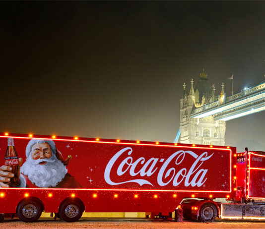 Holidays are coming with Coca-Cola The Coca-Cola Christmas Truck for 2024 season is in front of Tower Bridge during the night.