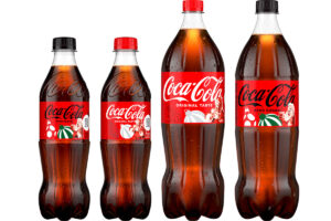 Pack shots of the updated Christmas pack design across Coca-Cola Original Taste and Coca-Cola Zero Sugar in both 500ml bottles and 1.5 litre bottles.