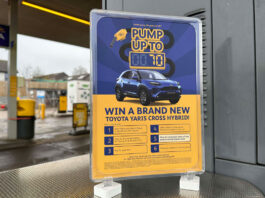 JET kicks off national prize draw A Jet forecourt garage with a POS highlighting a prize giveaway to win a new car.
