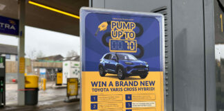 A Jet forecourt garage with a POS highlighting a prize giveaway to win a new car.