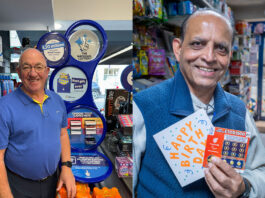 National Lottery operators stand at their tills to mark the landmark £50billion raised for good causes through the National Lottery.