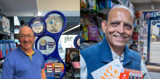 National Lottery operators stand at their tills to mark the landmark £50billion raised for good causes through the National Lottery.