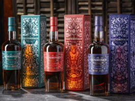 Bottles of The Glendronach The Master's Anthology range stand next to the outer packaging with Ode to The Valley, Ode to The Embers and Ode to The Dark.