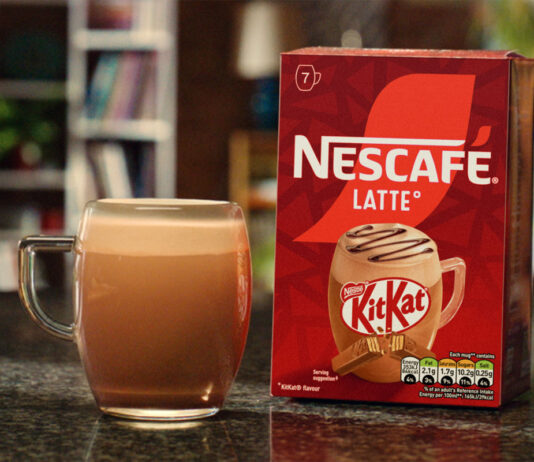 KitKat joins the Nescafé coffee range A pack of Nescafé KitKat Latte sits on a table with a cup of the coffee standing next to it.