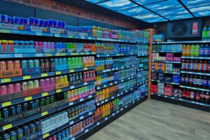 Premier Soft Drinks Cave room with soft drinks across the shelves and a blue sky made using TV screens on the roof.