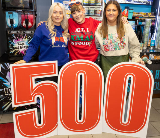 Spar Greenock is in the Christmas spirit Staff members from Ardgowan Hospice and Spar Greenock stand behind a large 500 sign in the Spar Greenock store.