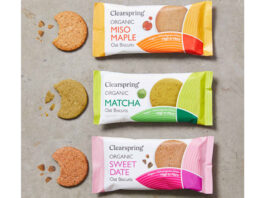 Clearspring launches international trio of oat biscuits Packs of Clearspring Oat Biscuits sit against a grey background including Miso Maple, Matcha and Sweet Date with the biscuits sitting outside the packet with bites taken out of them.