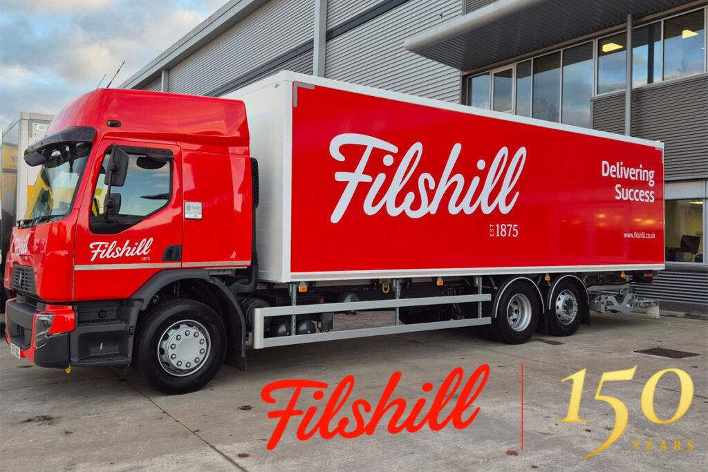 A JW FIlshill branded lorry sits in the wholesaler's depot with the Filshill 150 Years Logo.