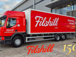 Filshill commits to success for landmark 150th anniversary year A JW FIlshill branded lorry sits in the wholesaler's depot with the Filshill 150 Years Logo.