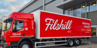 A JW FIlshill branded lorry sits in the wholesaler's depot with the Filshill 150 Years Logo.