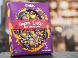 No hollow message from Gnaw this Easter A pack of Gnaw Easter Happy Easter Eggs-travaganza stands upright on a table with a blurred out background.