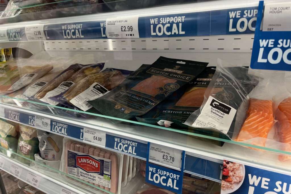 Image of a store's chiller shelf with different Scottish meats and fish products.