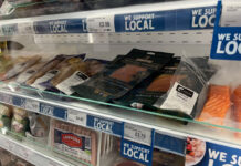 Image of a store's chiller shelf with different Scottish meats and fish products.