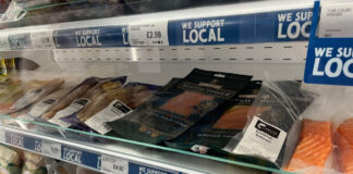 Image of a store's chiller shelf with different Scottish meats and fish products.