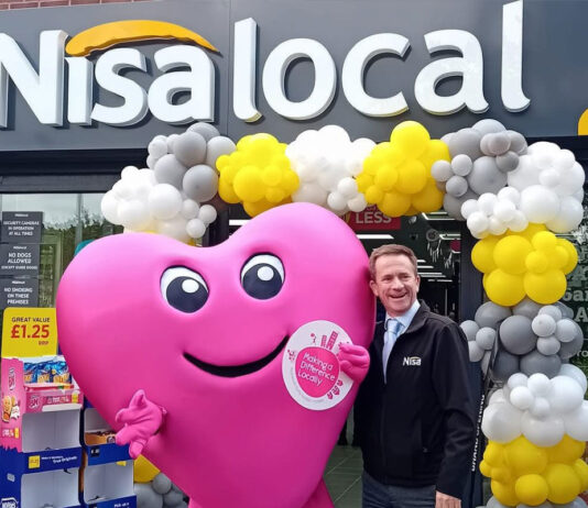 Nisa donates over £1million through its charity Nisa's Making a Difference Locally mascot Maddie stands outside of Nisa Local store during a store opening event.