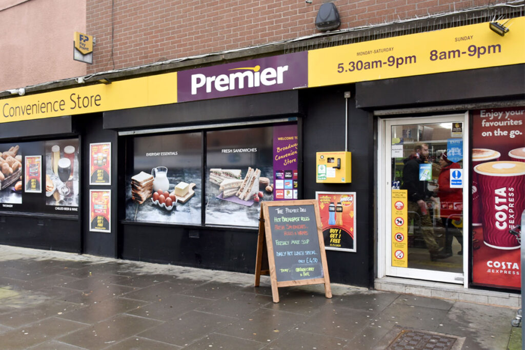 Image of the front of Premier Broadway Convenience Store in Oxgangs with a chalkboard outside the main door.