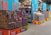 Interior shot of a Hancocks depot displaying massive pallets of confectionery brands.