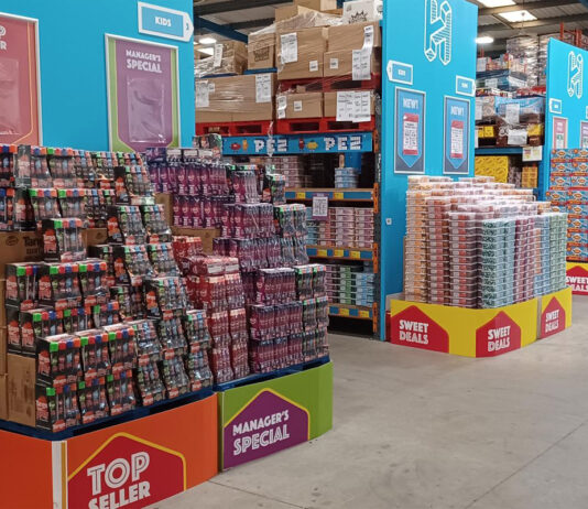 Hancocks announces next Sweetest Day event Interior shot of a Hancocks depot displaying massive pallets of confectionery brands.