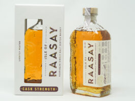 Isle of Raasay rolls out third cask strength whisky edition A bottle of Isle of Raasay Cask Strength Third Edition whisky stands next to the packaging for the whisky against a grey background.