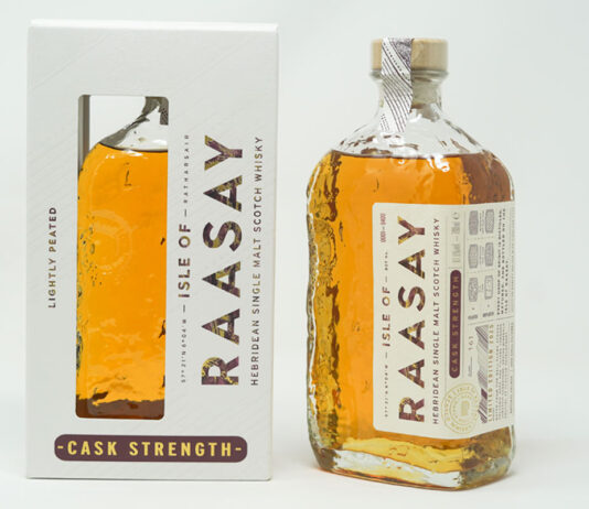 Isle of Raasay rolls out third cask strength whisky edition A bottle of Isle of Raasay Cask Strength Third Edition whisky stands next to the packaging for the whisky against a grey background.