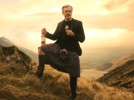 Lidl pokes fun at Harrison Ford ad following whisky win A man in a kilt stands against a sunset in the Highlands with a bottle of Ben Bracken whisky in his hand and a glass with the whisky inside in the other.