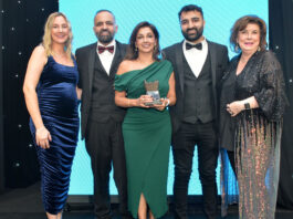 Awards Profile – The Innovation Award Laura McDiarmid, Vikas Sud, Shamly Sud, Guna Sud and Elaine C Smith all stand on the Scottish Grocer Awards 2024 stage whilst Shamly holds a trophy for The Innovation Award 2024.