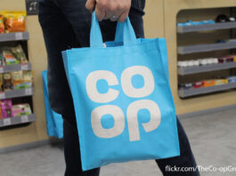 Co-op admits breach of Competitions Authority A person carries a blue Co-op Tote bag in a Co-op store with a photograph credit in the bottom right corner.