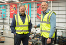 Simon Hannah, left, chief executive at JW Filshill stands inside the wholesaler's depot with Keith Geddes, right, chief financial and operating officer at Filshill.