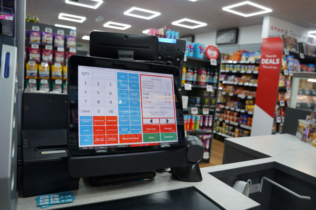 A till screen in a convenience store featuring the MPos software.