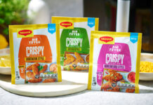 Packets of Maggi Air Fryer Crispy Coating range stand on a kitchen table including the Southern Style, Katsu Style and Korean BBQ Style variants.