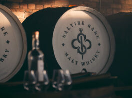 Saltire whisky spreads out around the world A whisky cask with the Saltire Rare Malt Whisky brand on the top of the lid with a bottle of whisky and nosing glasses in the foreground of the image.