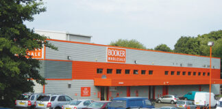 Exterior image of Booker Longstone depot in Edinburgh with cars in the car park.