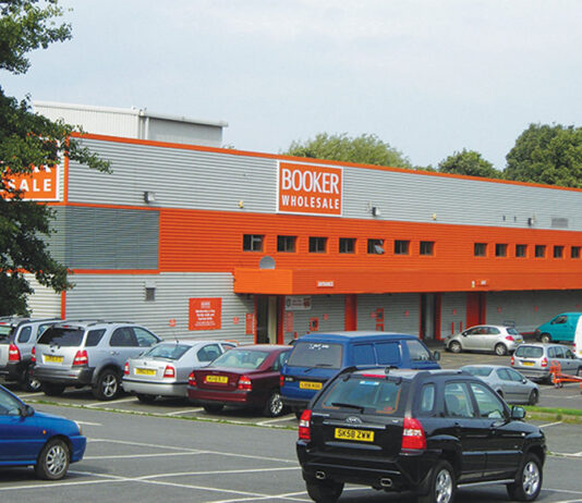 Booker symbol groups to benefit from Beer & Cider and Wine Festivals Exterior image of Booker Longstone depot in Edinburgh with cars in the car park.