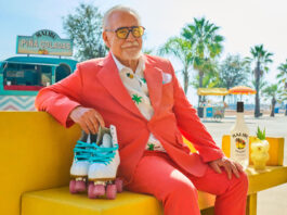 Brian Cox clocks off with new Malibu ad Hollywood actor Brian Cox sits on a yellow couch in a pink suit with sunglasses on whilst holding a pair of rollerblades in his right hand. There is a bottle of Malibu and a Piña Colada cocktail serve next to the bottle on a table to the actor's left.