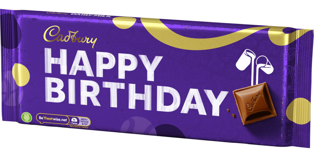 Pack shot of the Cadbury Dairy Milk Happy Birthday 360g gifting bar with the words Happy Birthday across the packaging.