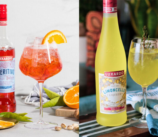 Spritz of refreshment from Luxardo The left image has a bottle of Luxardo Aperitivo stands next to The Pink Aperitivo serve with oranges, herbs and nuts around the glass. The image on the right has a bottle of Luxardo Limoncello with a Luxardo Limoncello Spritz serve next to it on with a blue and white tea towel next to the glass on the table.