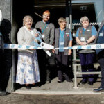 Co-op reopens its store in Skye A group of locals help to open Portree Co-op in Skye with a novelty pair of scissors being used to cut the ribbon at the store's door.