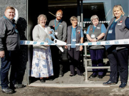 Co-op reopens its store in Skye A group of locals help to open Portree Co-op in Skye with a novelty pair of scissors being used to cut the ribbon at the store's door.