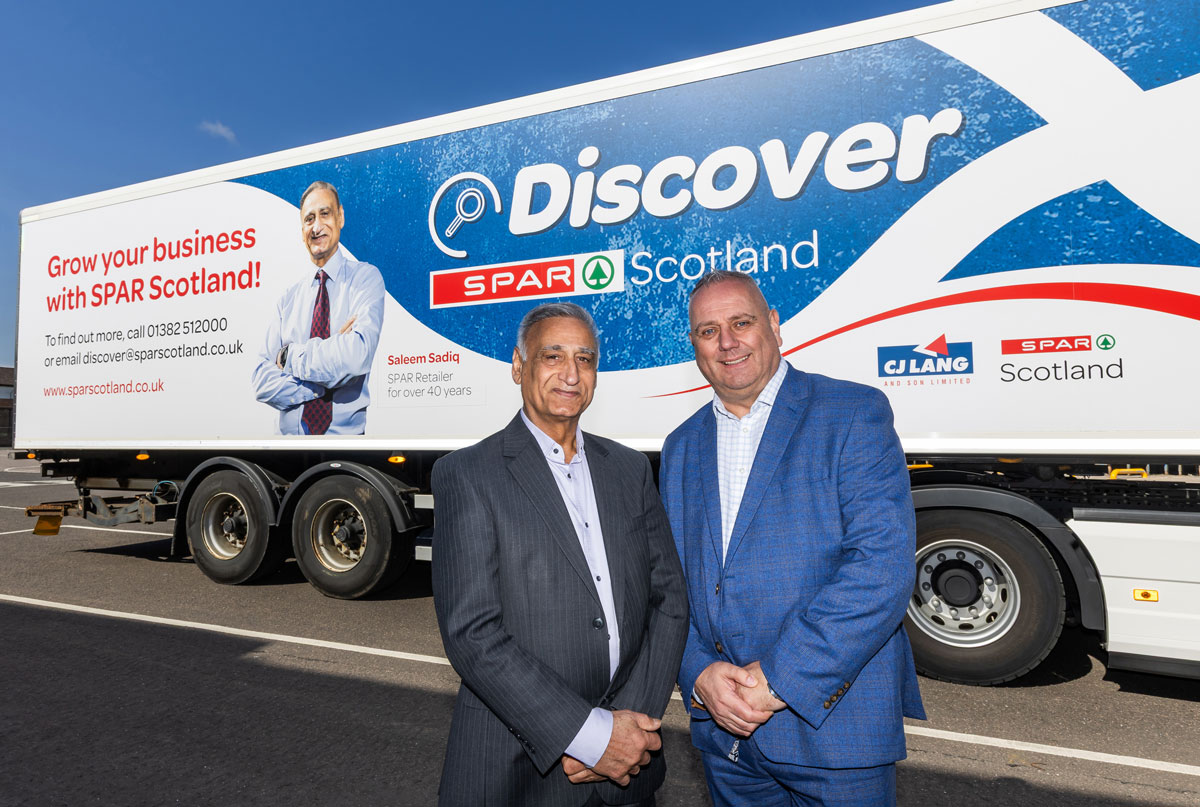 Veteran Spar Scotland retailer Saleem Sadiq and CJ Lang independent sales director Brian Straiton with the lorry livery for the campaign.