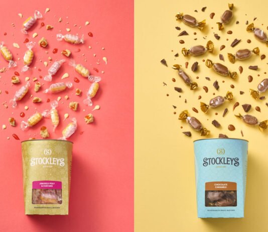 Classic dessert flavours roll out to Stockley’s sweets In the left image, a box of Stockley's Jam Roly Poly & Custard sweets lies down against a pink background with the sweets pouring out from the packet. In the right image a box of Stockley's Choc-Scotch lies against a yellow background with the sweets pouring out from the packet.