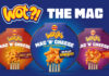 Packs of Wotsits Mac N Cheese variants including Mac N Cheese Really Cheesy flavour, Mac N Cheese Flamin' Hot and Mac N Cheese Sweet & Spicy. The three variants are against a blue background with text at the top reading 'Wot?! The Mac'.